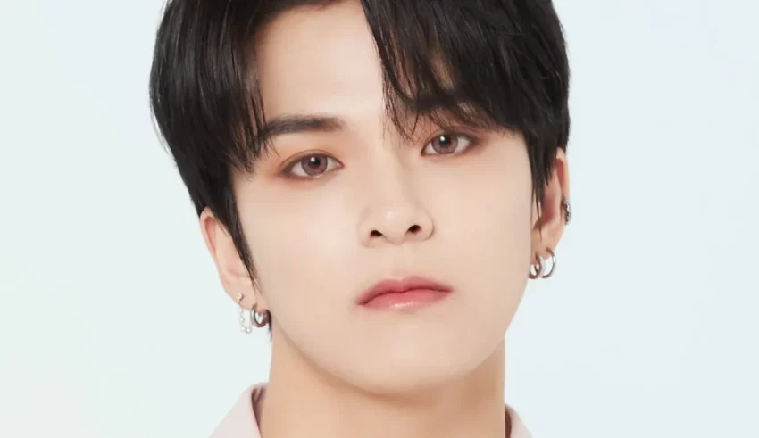 A young man with black hair and piercings.